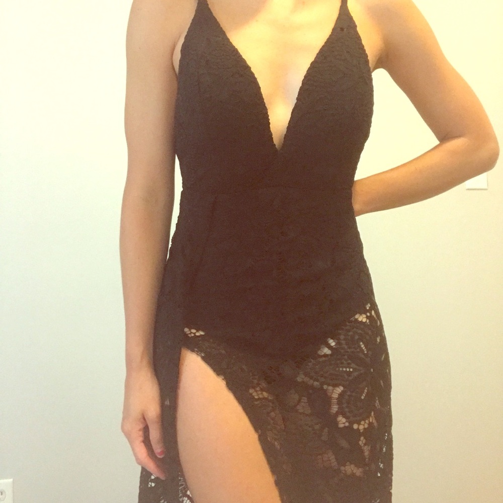 Dramatic black lace leotard dress with high slit